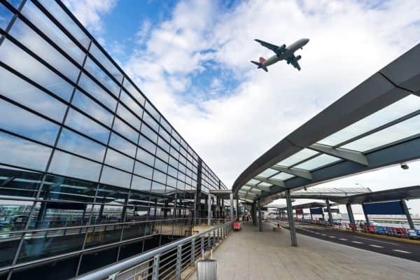 A view from ground level of an airport of an aeroplane just taking off