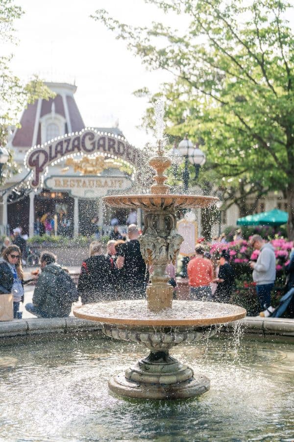 People sitting outside the Plaza Gardens Restaurant at Disneyland Paris