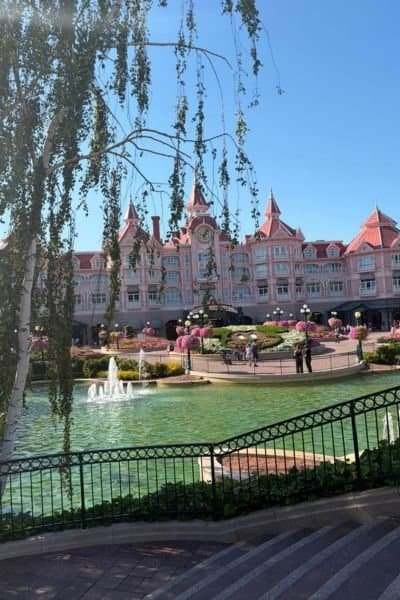 The pink Disneyland Hotel at Disneyland Paris with water feature. Taken during the summer