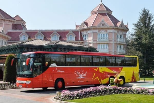 The Magical Express Bus in front of the Disneyland Paris Hotel. One of the best ways to get to Disneyland Paris from the airport
